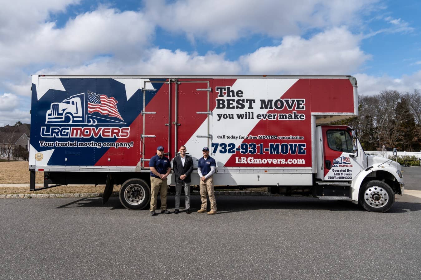 The LRG team in front of a large removal truck.